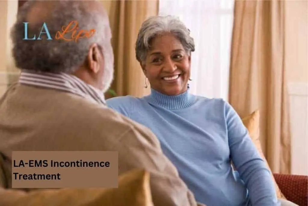 Couple sat smiling at each other - LA-EMS treatment Warwickshire
