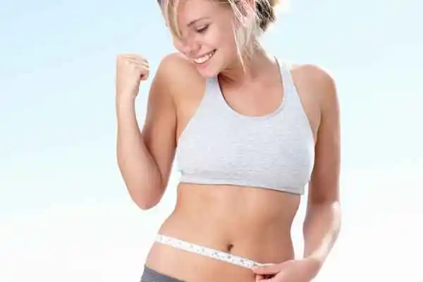 woman happy after fat reduction treatment Warwickshire
